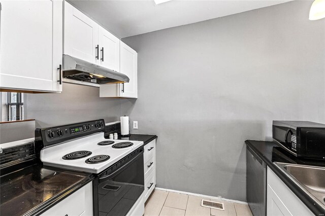 kitchen with light tile patterned floors, stainless steel dishwasher, white cabinetry, and white range with electric stovetop