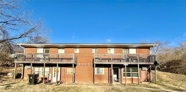 rear view of house featuring a balcony