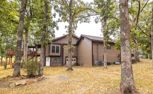 view of front of house featuring a wooden deck and central AC unit