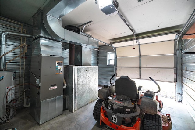 garage with gas water heater, heating unit, and a garage door opener