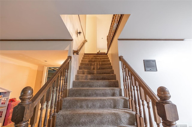 stairway with crown molding