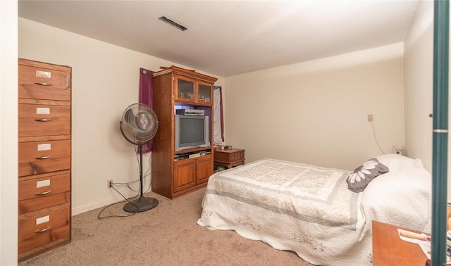 bedroom with light colored carpet