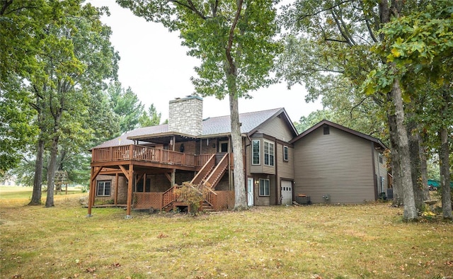 rear view of property featuring a deck, a yard, stairway, and a chimney