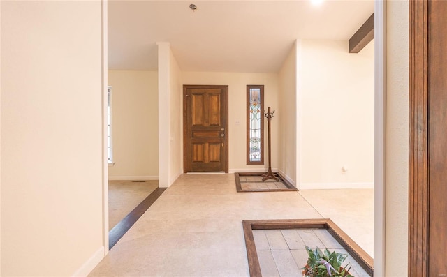 entrance foyer featuring baseboards