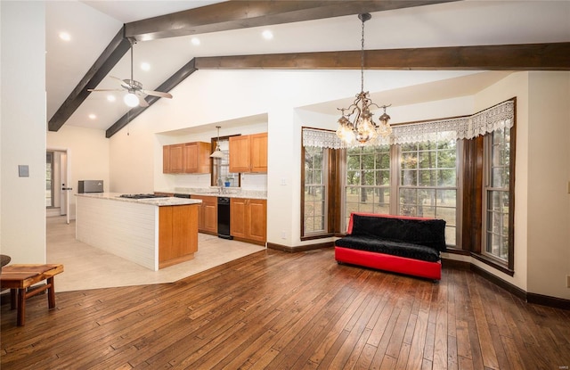 kitchen featuring lofted ceiling with beams, light wood-style floors, baseboards, and ceiling fan with notable chandelier