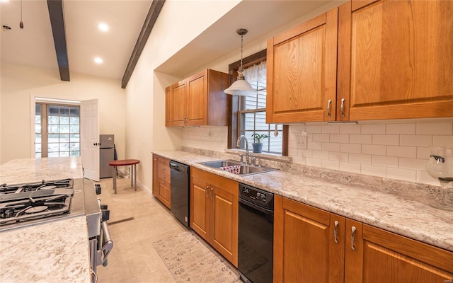 kitchen featuring tasteful backsplash, plenty of natural light, black dishwasher, and a sink