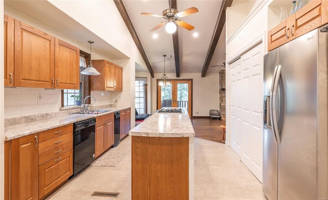 kitchen featuring stainless steel appliances, a sink, a kitchen island, visible vents, and beamed ceiling