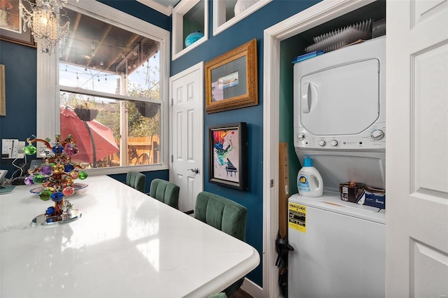 interior space featuring stacked washer and dryer