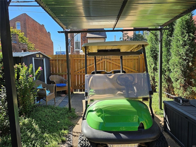 view of yard with a patio and a storage unit