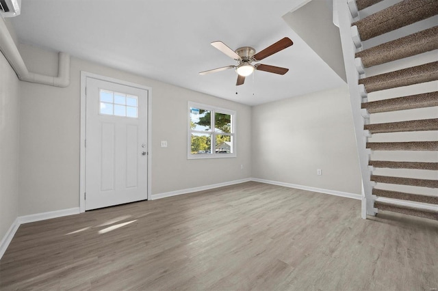 entrance foyer featuring ceiling fan and hardwood / wood-style flooring