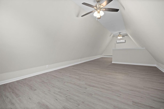 additional living space with lofted ceiling, ceiling fan, and hardwood / wood-style floors