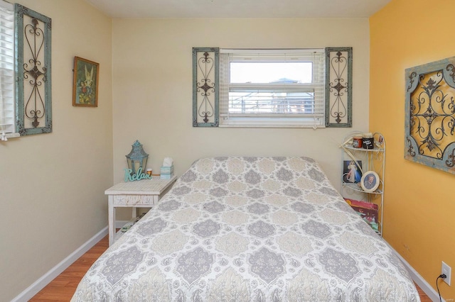 bedroom with wood-type flooring