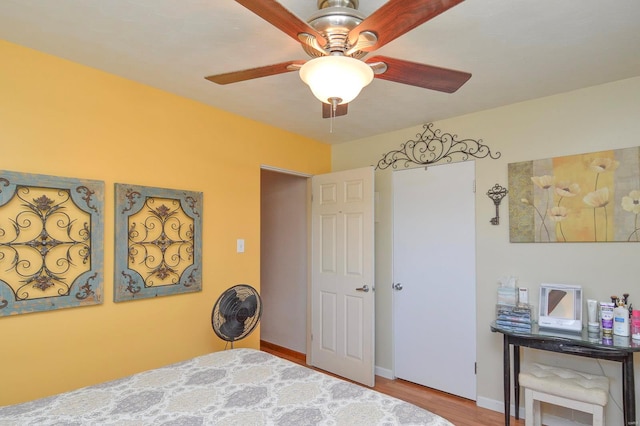 bedroom featuring ceiling fan and hardwood / wood-style floors