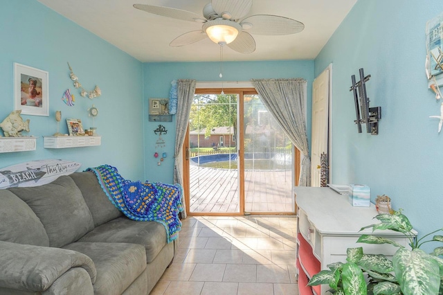 living room with ceiling fan and light tile patterned flooring