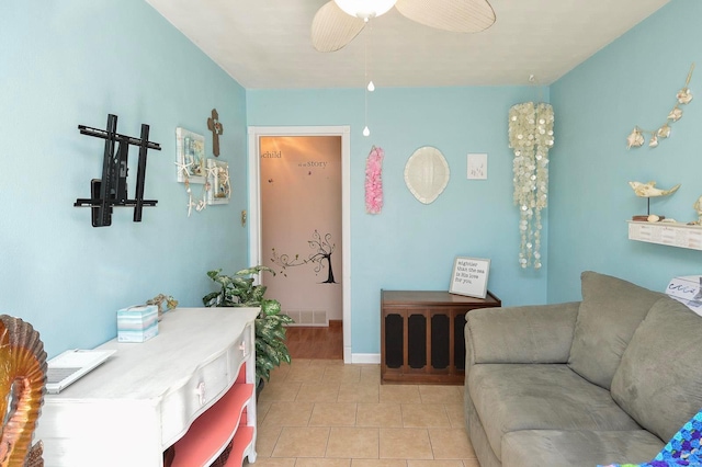 tiled living room with ceiling fan