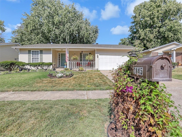 ranch-style home with a front lawn, covered porch, and a garage