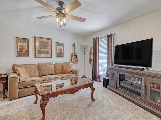 living room with ceiling fan and light colored carpet