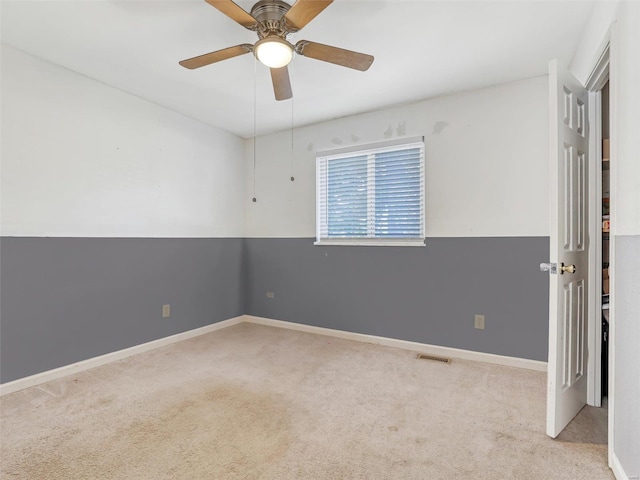 unfurnished room with ceiling fan and light colored carpet