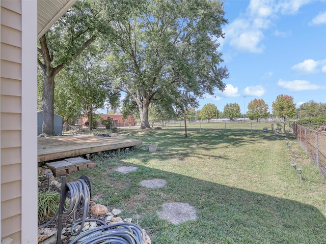 view of yard featuring a wooden deck