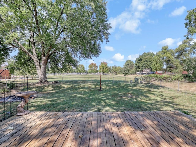 wooden deck with a lawn