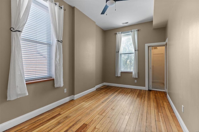 unfurnished room with ceiling fan and light hardwood / wood-style flooring