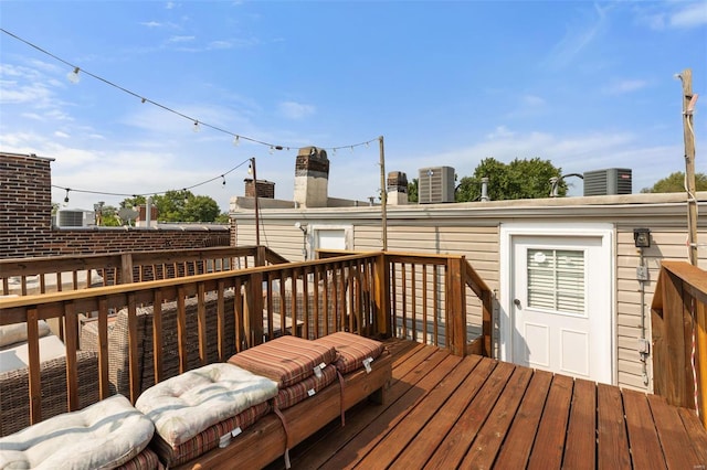 wooden deck featuring cooling unit