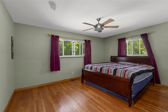 bedroom featuring ceiling fan and hardwood / wood-style flooring