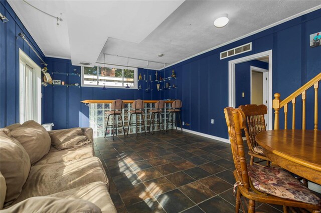 living room featuring crown molding