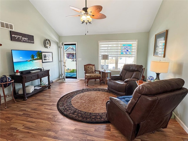 living room with vaulted ceiling, hardwood / wood-style floors, and ceiling fan