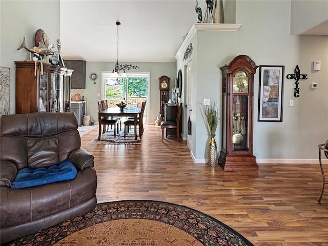 living room with hardwood / wood-style flooring and a chandelier