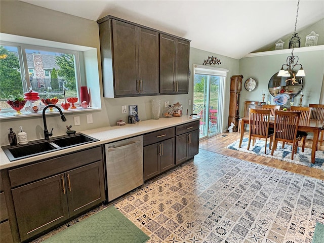 kitchen featuring dark brown cabinetry, sink, stainless steel dishwasher, vaulted ceiling, and light hardwood / wood-style floors