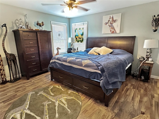 bedroom with hardwood / wood-style floors and ceiling fan