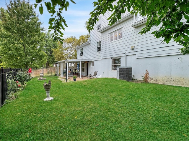 view of yard featuring central AC, a pergola, and a patio