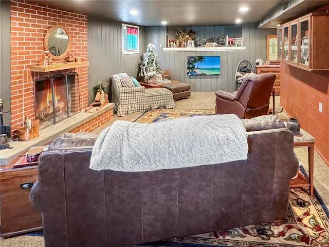 living room with light carpet and a brick fireplace