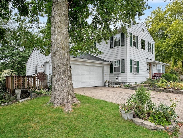 view of front of home with a garage and a front yard