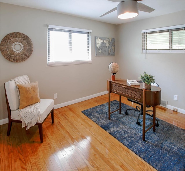 office space featuring hardwood / wood-style floors and ceiling fan