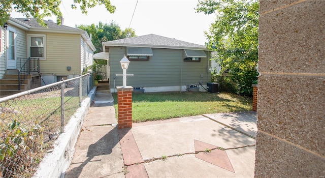 exterior space featuring a yard and central AC unit