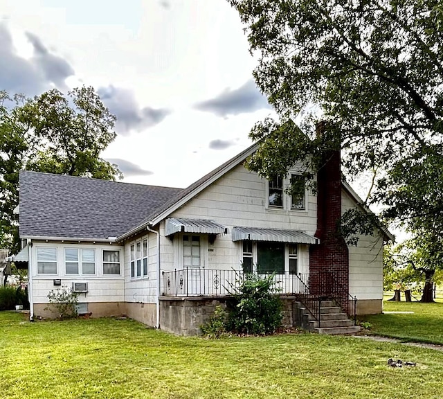 back of house with a yard