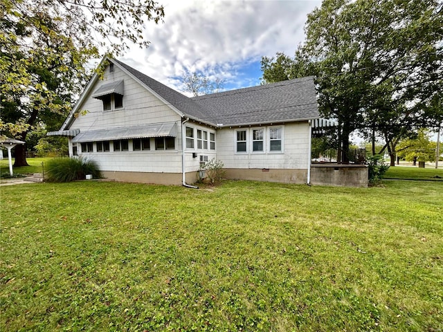 view of home's exterior with a yard