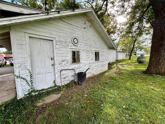 view of property exterior with a lawn