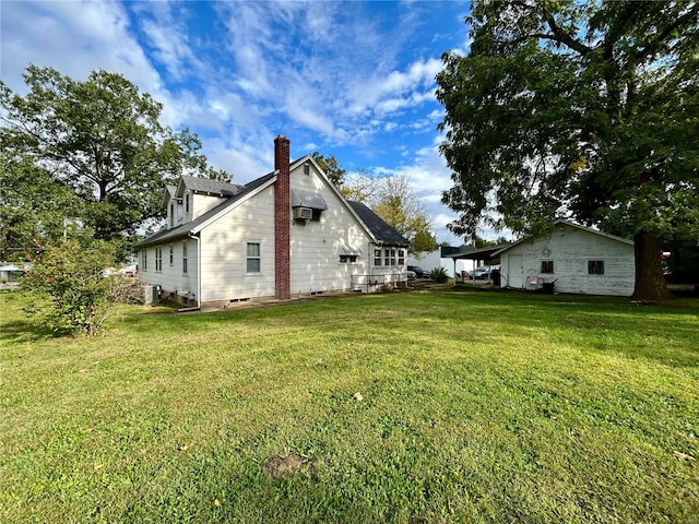 view of yard featuring central AC unit and an AC wall unit