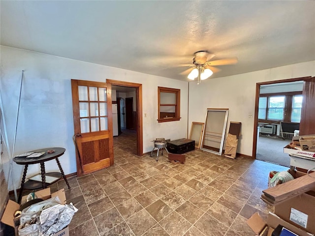 living area featuring ceiling fan