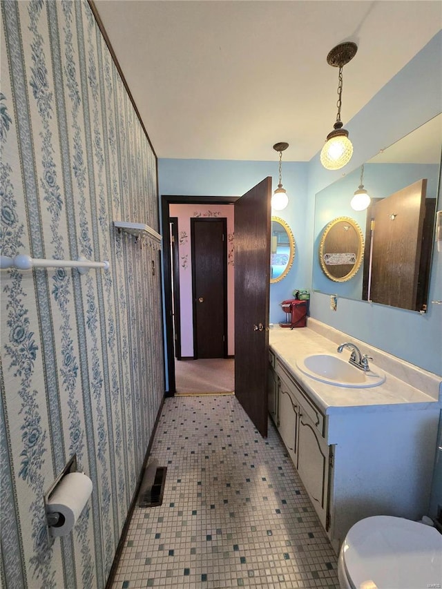 bathroom with vanity and toilet