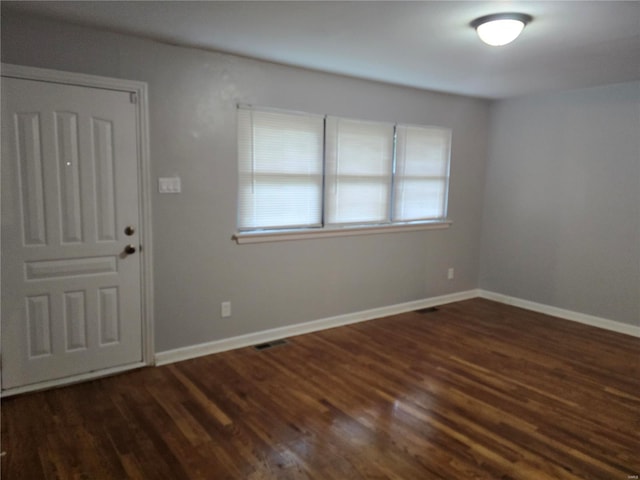 entryway with dark wood-type flooring