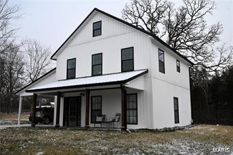 modern inspired farmhouse with covered porch