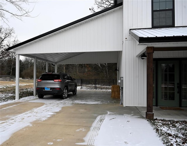 view of snow covered parking