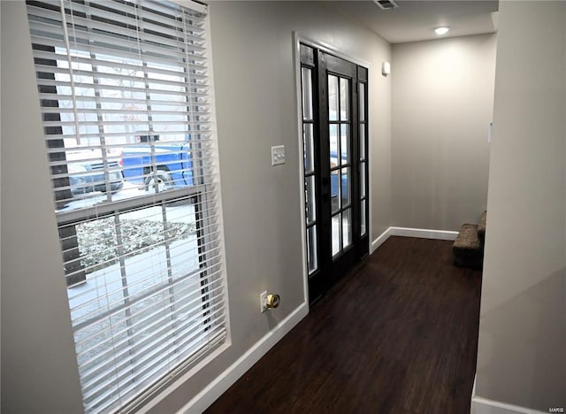 doorway to outside with dark hardwood / wood-style floors