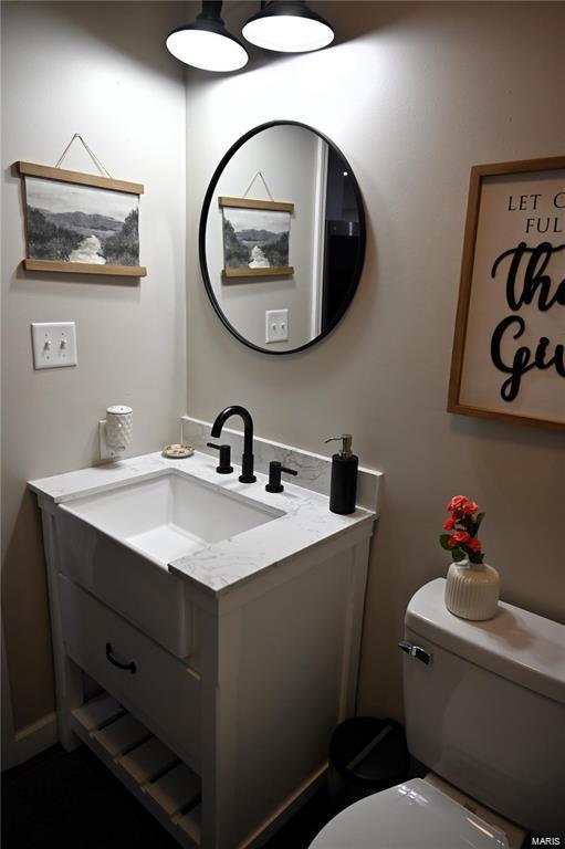 bathroom with vanity and toilet