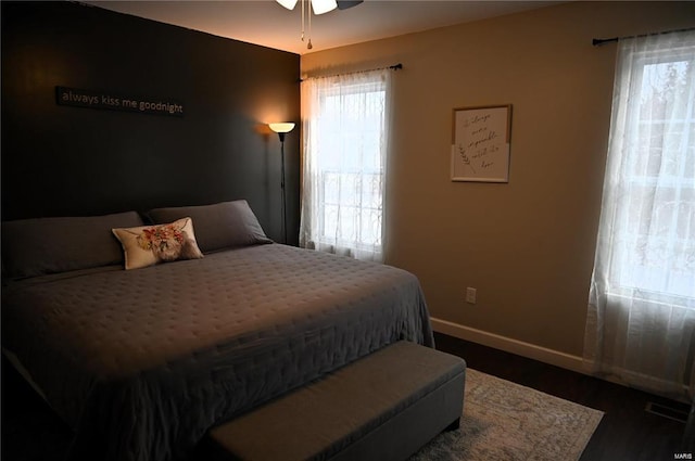 bedroom featuring ceiling fan and dark hardwood / wood-style floors