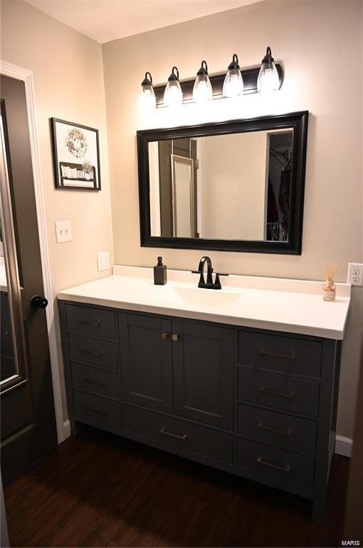 bathroom featuring wood-type flooring and vanity